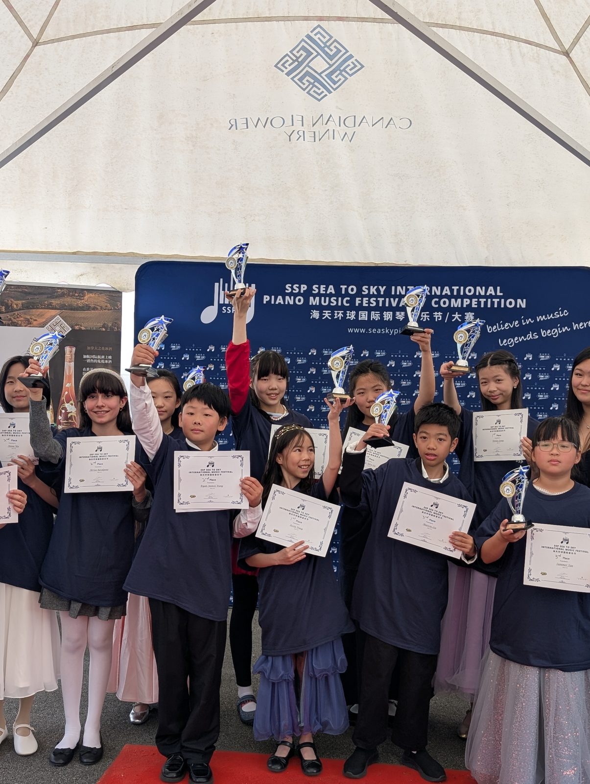 Young pianists with trophies and certificates at the Sea to Sky International Piano Festival 2026